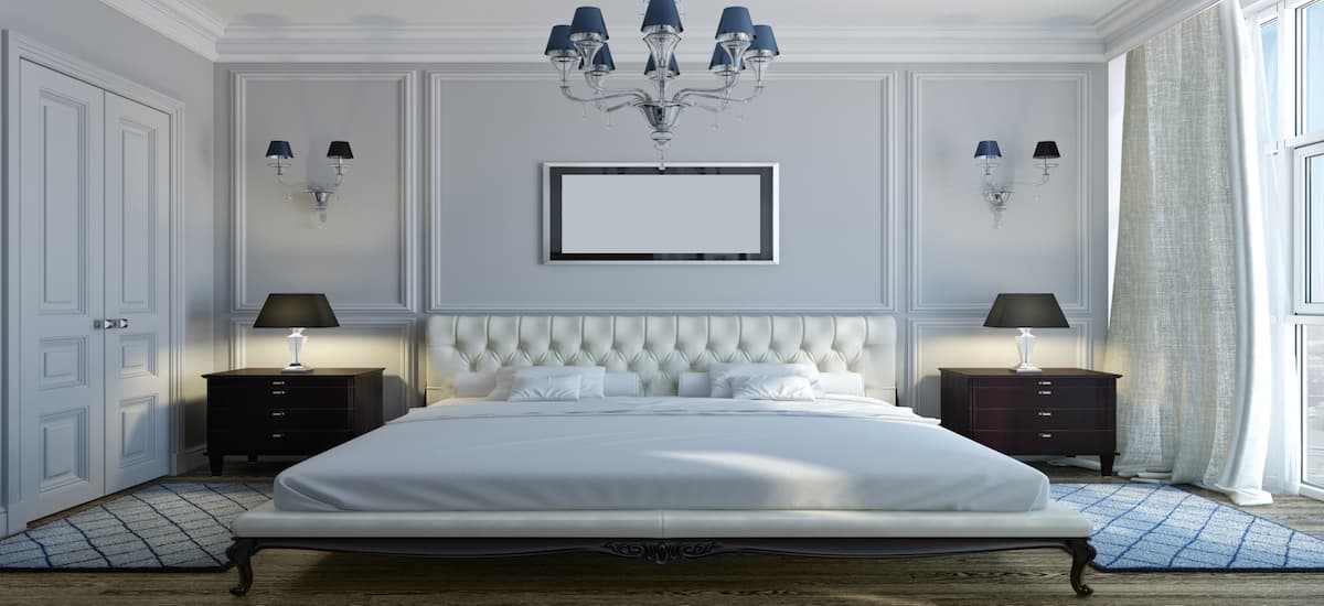Elegant bedroom interior with tufted headboard and classic decor